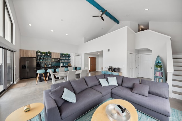 7469 Lake Solis Dr, Stevensville, MI 49127 - living room featuring high vaulted ceiling, beamed ceiling, stairway, baseboards, and recessed lighting