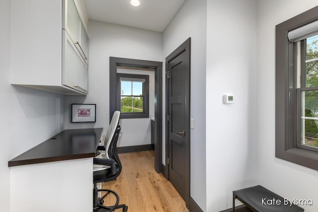 657 Greenslate Dr SE, Ada, MI 49301 - home office with light wood-style floors and recessed lighting