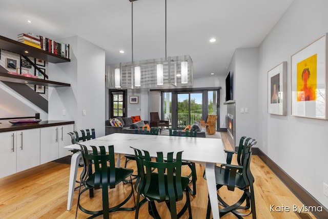 657 Greenslate Dr SE, Ada, MI 49301 - dining room featuring light wood finished floors and recessed lighting