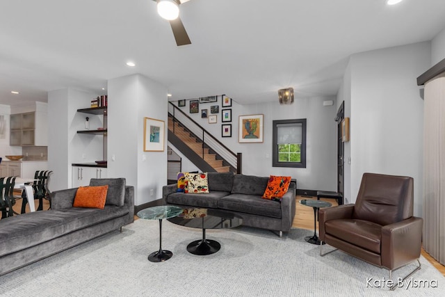657 Greenslate Dr SE, Ada, MI 49301 - living room featuring stairway, a ceiling fan, recessed lighting, and wood finished floors