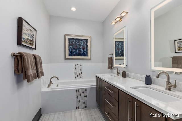 657 Greenslate Dr SE, Ada, MI 49301 - bathroom with a garden tub and double vanity