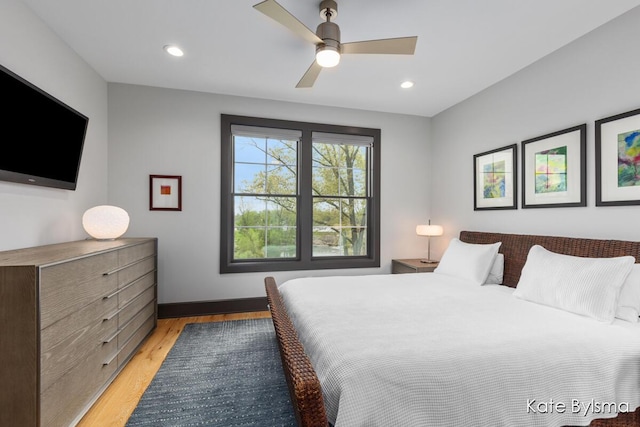 657 Greenslate Dr SE, Ada, MI 49301 - bedroom featuring light wood-style flooring, baseboards, recessed lighting, and ceiling fan