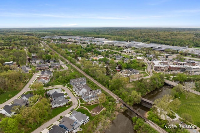 657 Greenslate Dr SE, Ada, MI 49301 - aerial overview of property's location with a large body of water and a heavily wooded area
