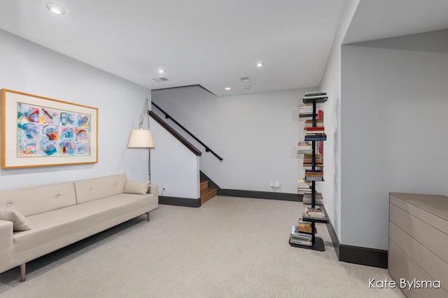 657 Greenslate Dr SE, Ada, MI 49301 - carpeted living area featuring stairway, baseboards, and recessed lighting