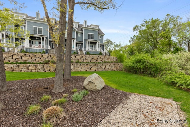 657 Greenslate Dr SE, Ada, MI 49301 - view of front of house featuring a front lawn and a chimney