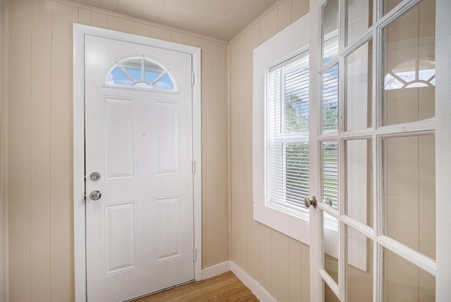 2335 Holmes Rd, Ypsilanti, MI 48198 - entrance foyer featuring healthy amount of natural light, light wood finished floors, crown molding, and baseboards