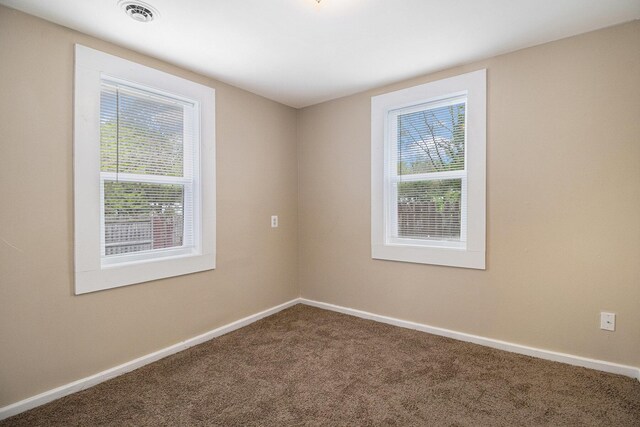 2335 Holmes Rd, Ypsilanti, MI 48198 - carpeted empty room with baseboards