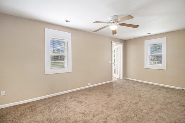 2335 Holmes Rd, Ypsilanti, MI 48198 - unfurnished room featuring healthy amount of natural light, carpet, and baseboards