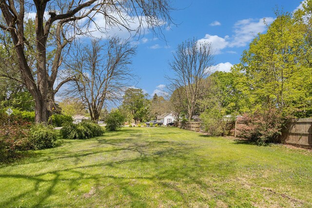 2335 Holmes Rd, Ypsilanti, MI 48198 - view of yard with a storage shed and an outdoor structure