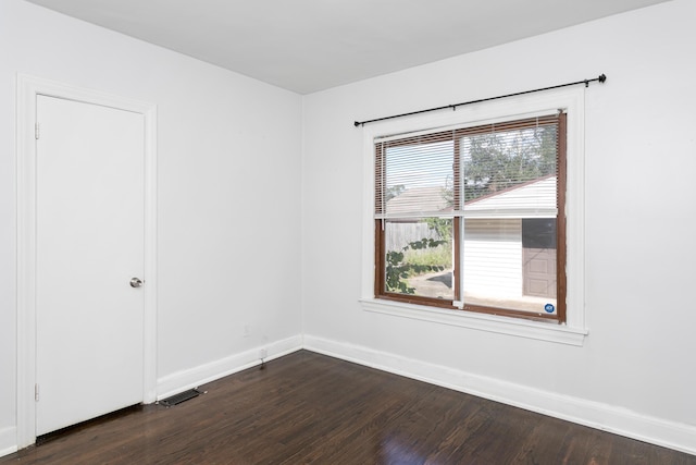 18106 Roselawn St, Detroit, MI 48221 - unfurnished room featuring baseboards and dark wood-style flooring