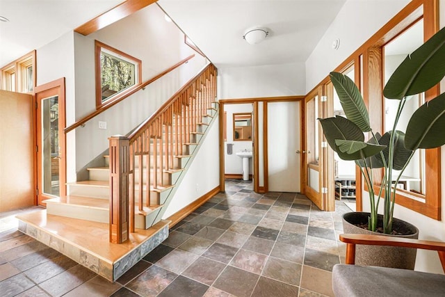 6800 Harbert Rd, Harbert, MI 49115 - entrance foyer with stone tile floors, stairway, and baseboards