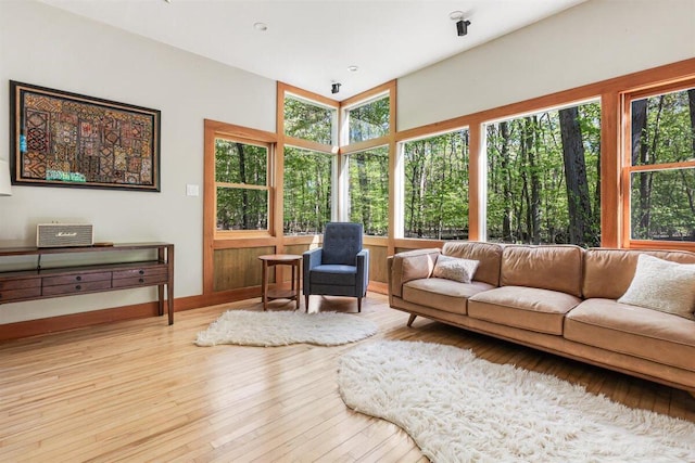6800 Harbert Rd, Harbert, MI 49115 - living area with plenty of natural light, wood finished floors, and baseboards