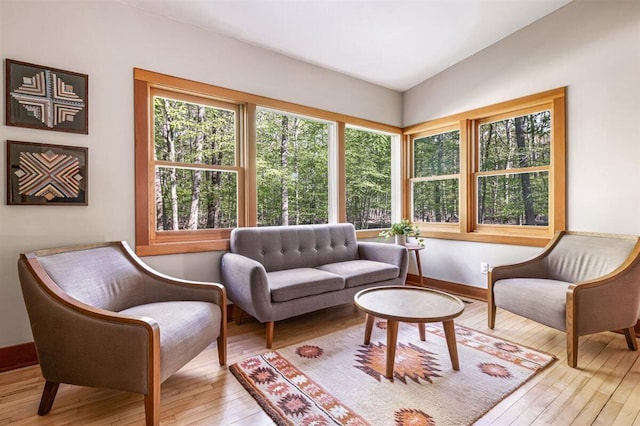 6800 Harbert Rd, Harbert, MI 49115 - sitting room featuring hardwood / wood-style floors, baseboards, and lofted ceiling