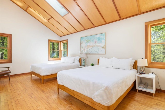 6800 Harbert Rd, Harbert, MI 49115 - bedroom with light wood-style flooring, lofted ceiling, and baseboards