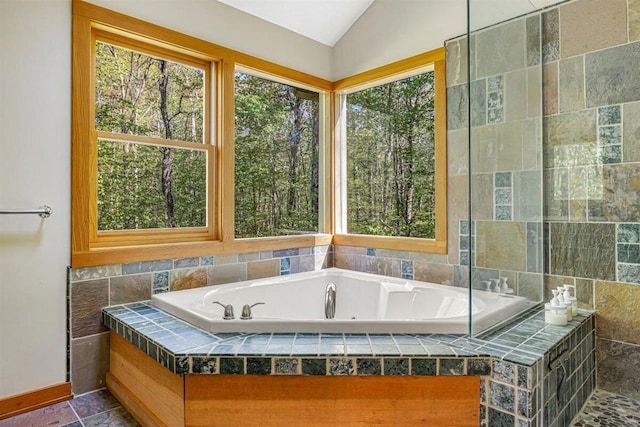 6800 Harbert Rd, Harbert, MI 49115 - full bath featuring plenty of natural light, a jetted tub, lofted ceiling, and baseboards