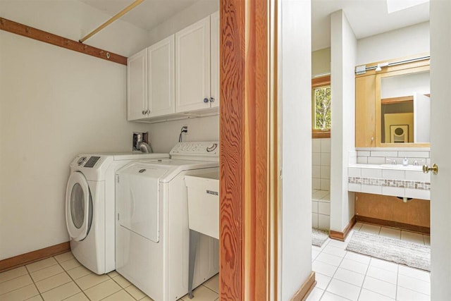 6800 Harbert Rd, Harbert, MI 49115 - washroom with cabinet space, separate washer and dryer, light tile patterned flooring, and baseboards