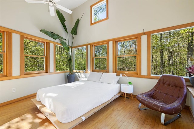 6800 Harbert Rd, Harbert, MI 49115 - bedroom with wood-type flooring, a towering ceiling, and baseboards