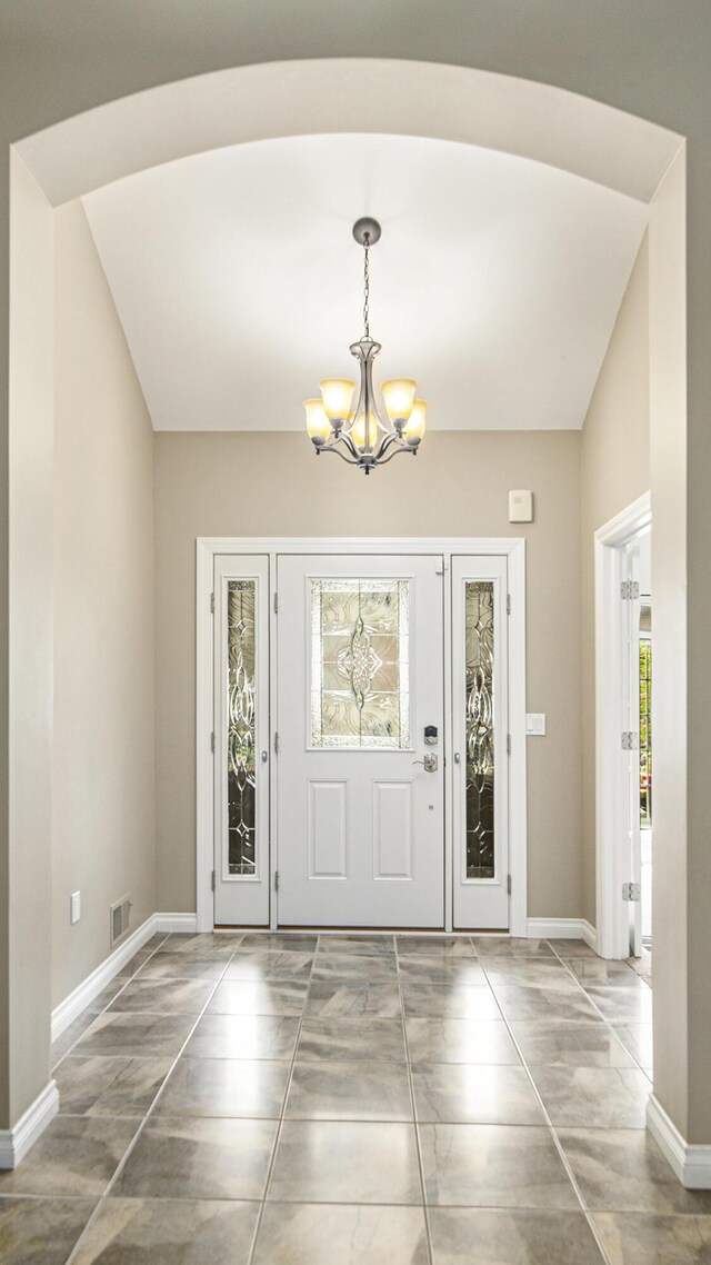 4607 Spring Mountain Dr, Brighton, MI 48116 - entryway with a chandelier and baseboards