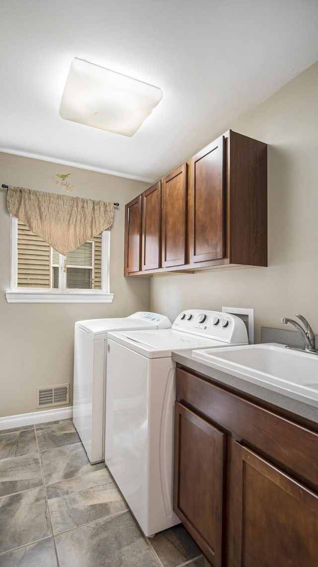 4607 Spring Mountain Dr, Brighton, MI 48116 - laundry area with cabinet space and independent washer and dryer