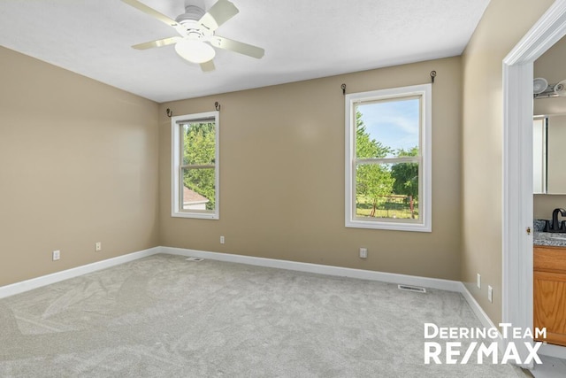 5909 Maple Bend Trl, Allendale, MI 49401 - unfurnished room featuring plenty of natural light, light carpet, and a ceiling fan
