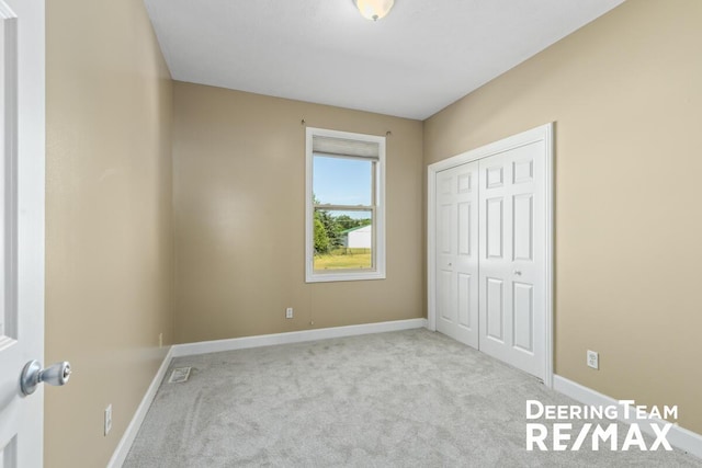 5909 Maple Bend Trl, Allendale, MI 49401 - unfurnished bedroom featuring carpet and a closet