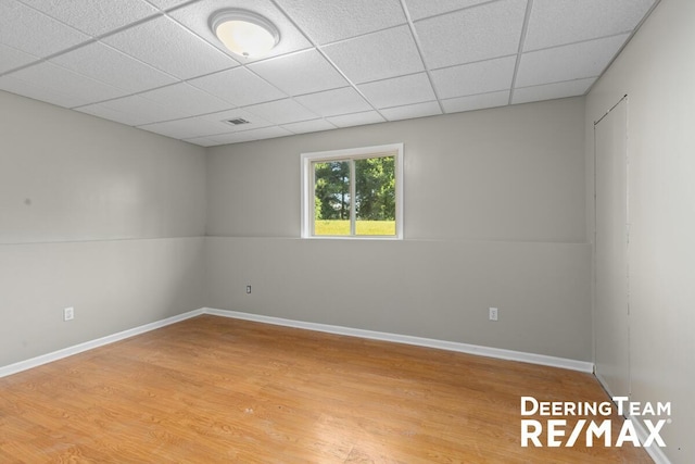 5909 Maple Bend Trl, Allendale, MI 49401 - unfurnished room with wood finished floors and a paneled ceiling