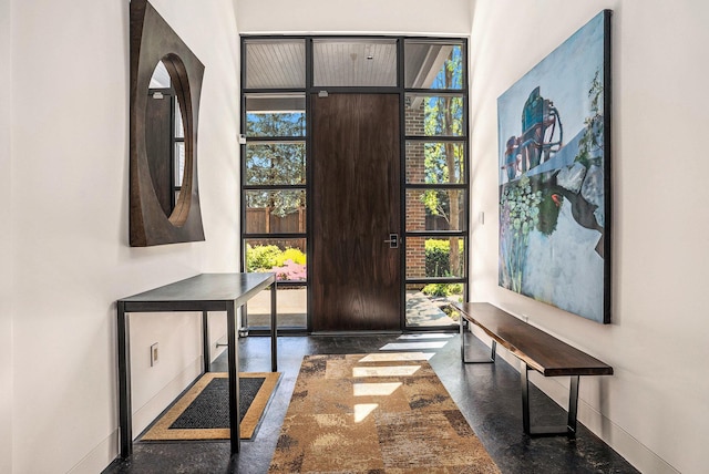 26 W 6th St, Holland, MI 49423 - foyer entrance featuring plenty of natural light, baseboards, and a towering ceiling