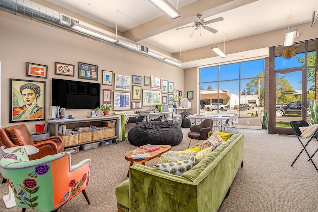 26 W 6th St, Holland, MI 49423 - carpeted living room with a ceiling fan and a towering ceiling