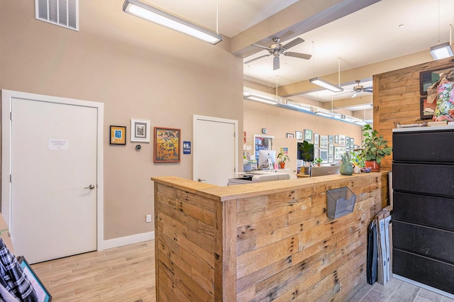 26 W 6th St, Holland, MI 49423 - kitchen with a ceiling fan, light wood-type flooring, butcher block counters, and baseboards