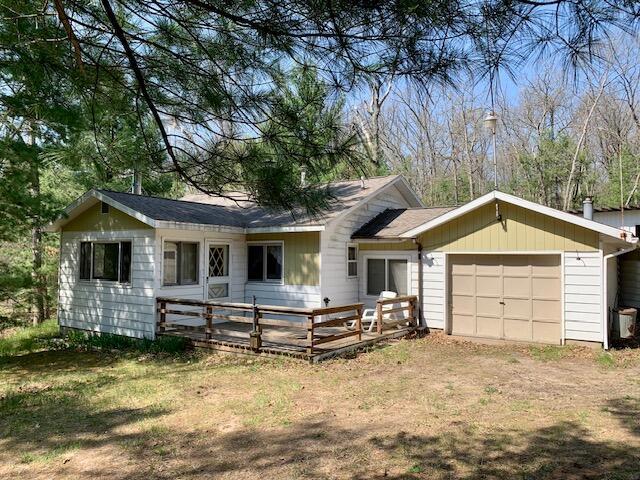 4827 W Unora Park Dr, Baldwin, MI 49304 - view of front of home featuring a garage, driveway, and a deck