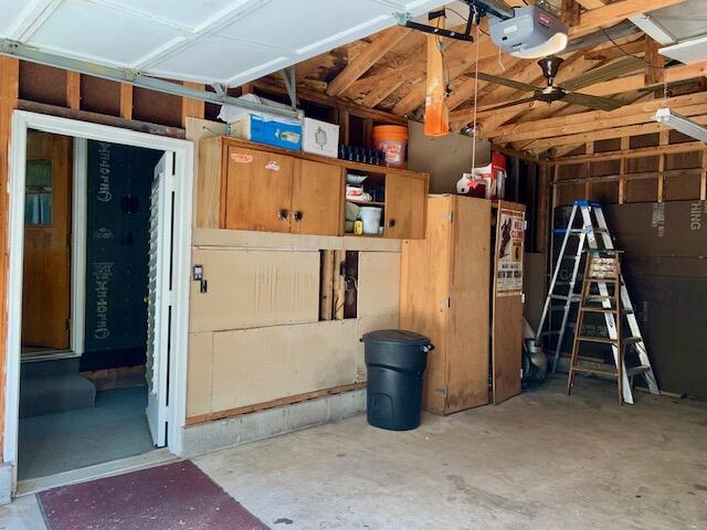4827 W Unora Park Dr, Baldwin, MI 49304 - garage featuring a garage door opener