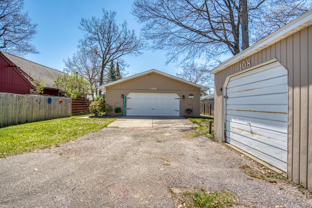 108 Eastbrook Ave, Houghton Lake, MI 48629 - detached garage featuring fence