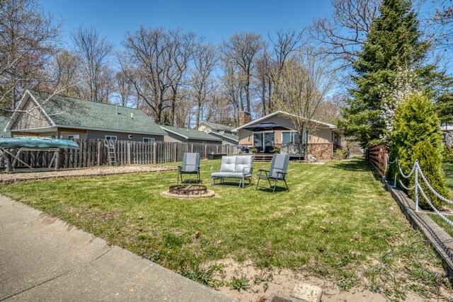 108 Eastbrook Ave, Houghton Lake, MI 48629 - view of yard with a fire pit