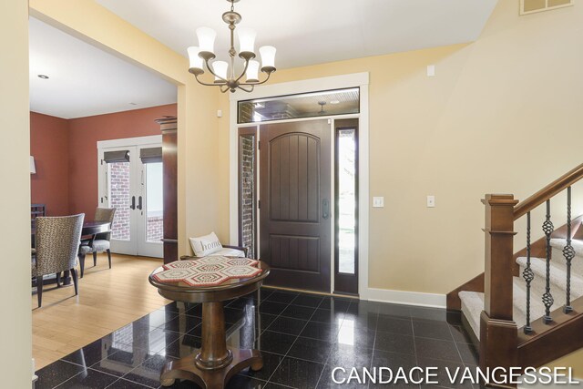 2429 Shears Crossing Ct NE, Grand Rapids, MI 49525 - foyer entrance featuring granite tiled floors, a chandelier, baseboards, and stairs