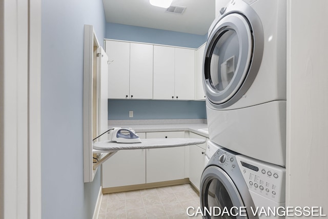 2429 Shears Crossing Ct NE, Grand Rapids, MI 49525 - laundry area with estacked washer and dryer and cabinet space