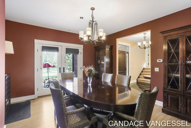 2429 Shears Crossing Ct NE, Grand Rapids, MI 49525 - dining area with a chandelier, french doors, light wood-style floors, and baseboards