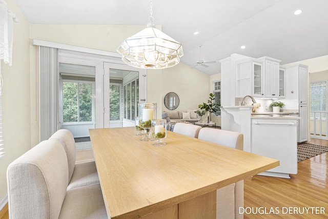 7470 Parmalee Rd, Middleville, MI 49333 - dining space featuring light wood-style floors, lofted ceiling, a chandelier, ceiling fan, and recessed lighting