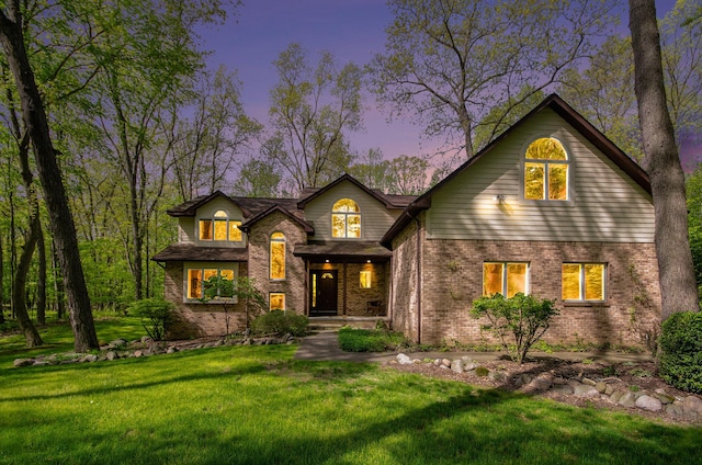 8461 Webster Hills Rd, Dexter, MI 48130 - traditional-style house featuring brick siding and a lawn