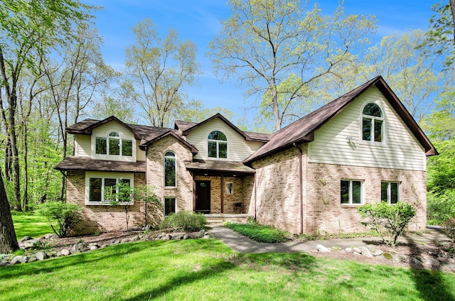 8461 Webster Hills Rd, Dexter, MI 48130 - view of front of property with brick siding and a front lawn