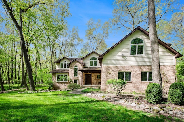 8461 Webster Hills Rd, Dexter, MI 48130 - traditional-style home featuring brick siding and a front lawn