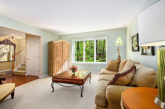 8461 Webster Hills Rd, Dexter, MI 48130 - carpeted living area with baseboards and stairs