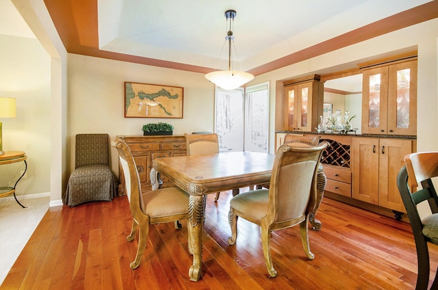 8461 Webster Hills Rd, Dexter, MI 48130 - dining room with light wood finished floors, baseboards, and a tray ceiling