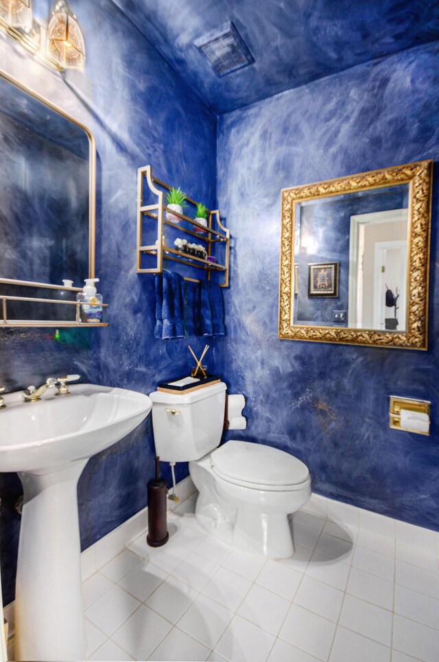 8461 Webster Hills Rd, Dexter, MI 48130 - bathroom featuring tile patterned floors, toilet, and a sink