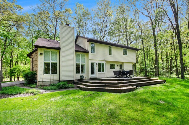 8461 Webster Hills Rd, Dexter, MI 48130 - back of house featuring a wooden deck, a chimney, a lawn, and outdoor dining area