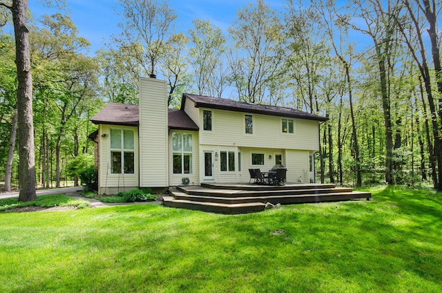 8461 Webster Hills Rd, Dexter, MI 48130 - rear view of house featuring a chimney, a yard, and a wooden deck