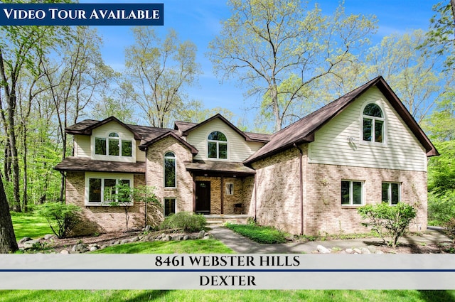 8461 Webster Hills Rd, Dexter, MI 48130 - view of front facade featuring brick siding