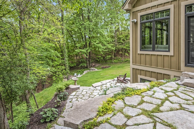 4850 Catamount Trl NE, Ada, MI 49301 - view of green lawn featuring a patio area