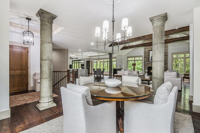 4850 Catamount Trl NE, Ada, MI 49301 - dining room with decorative columns, a chandelier, recessed lighting, wood finished floors, and a fireplace