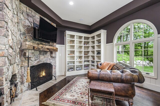 4850 Catamount Trl NE, Ada, MI 49301 - living room with a stone fireplace and wood finished floors