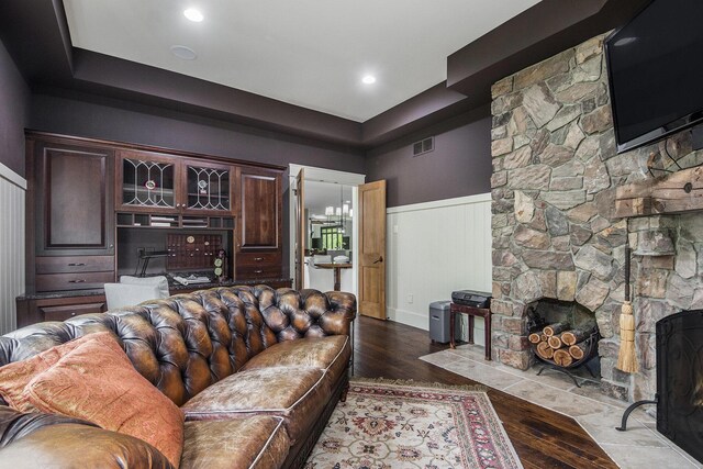4850 Catamount Trl NE, Ada, MI 49301 - living room featuring wainscoting, a fireplace, and dark wood-style floors